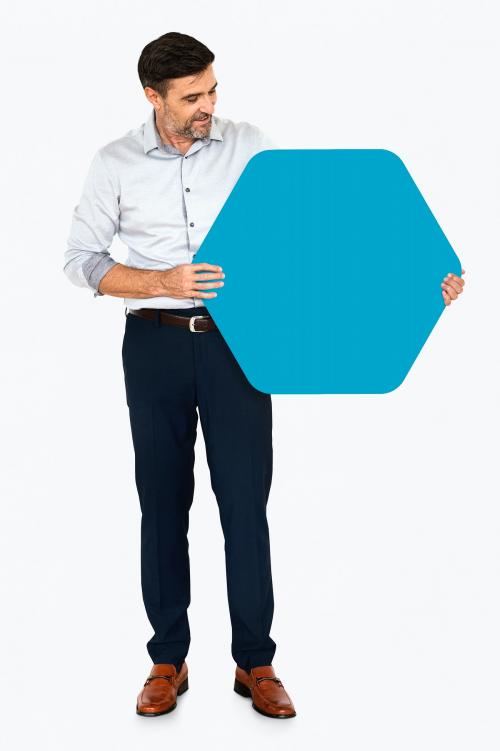 Cheerful man showing a blank blue hexagon shaped board - 491193