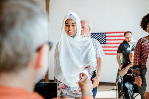 American Muslim queuing at a polling place - 2027406