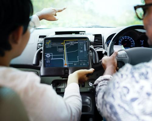 Couple in a car finding direction on a tablet with gps - 484886