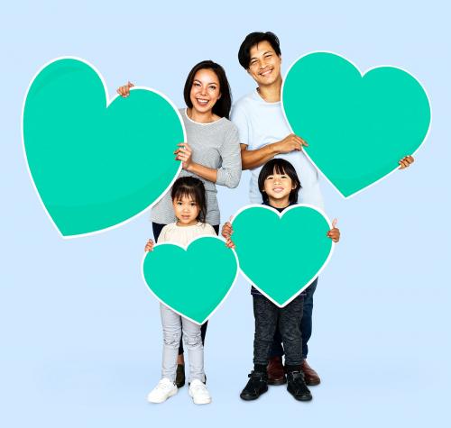 Happy family holding heart icons - 490304