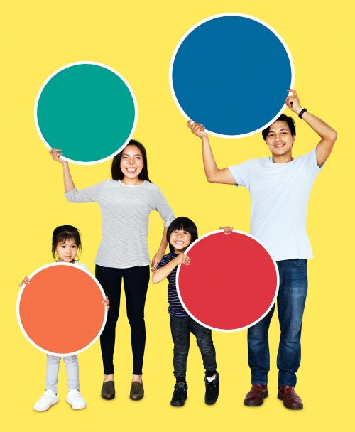 Happy family holding colorful round boards - 490424