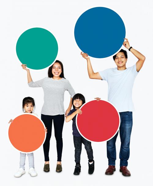 Happy family holding colorful round boards - 490462