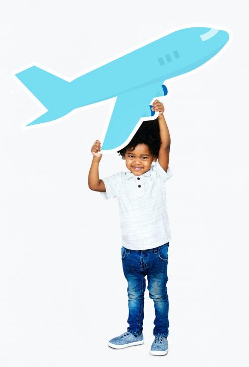 Happy boy holding an airplane icon - 490666