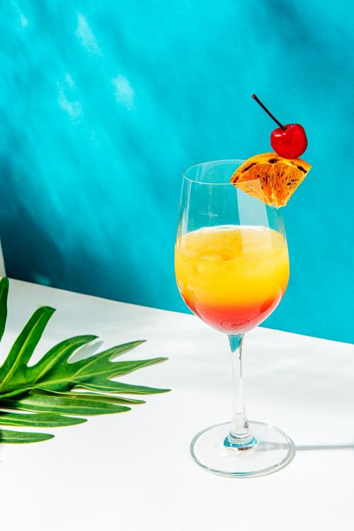 Tequila sunrise cocktail on blue background - 2280469