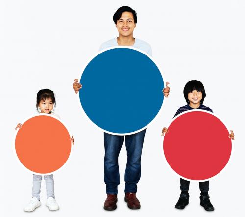Happy family holding colorful round boards - 490789