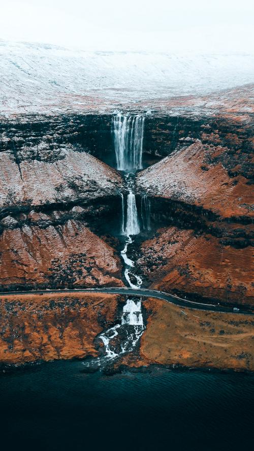 Drone shot of highland waterfall in Faroe Islands - 2208495