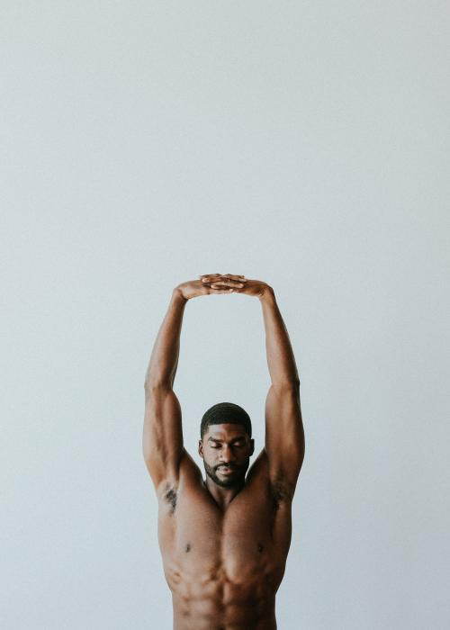 Naked black man stretching his arms - 1219006