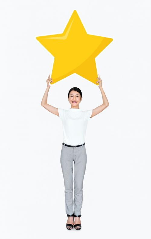 Businesswoman holding a golden star rating symbol - 477194