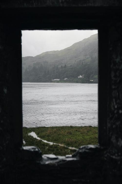 Sea view through a rocky window of Kilchurn Castle, Scotland - 1233338