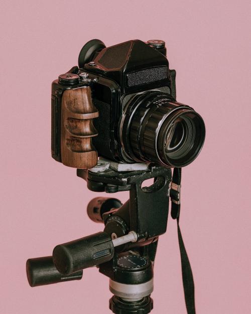 Vintage film camera on a tripod - 598285