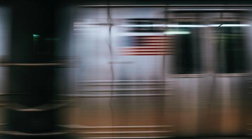 Blurred American flag on a moving train - 1219186