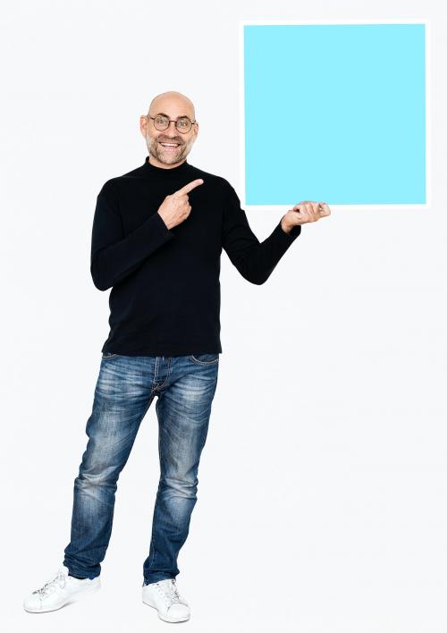 A cheerful man holding a square icon - 475087
