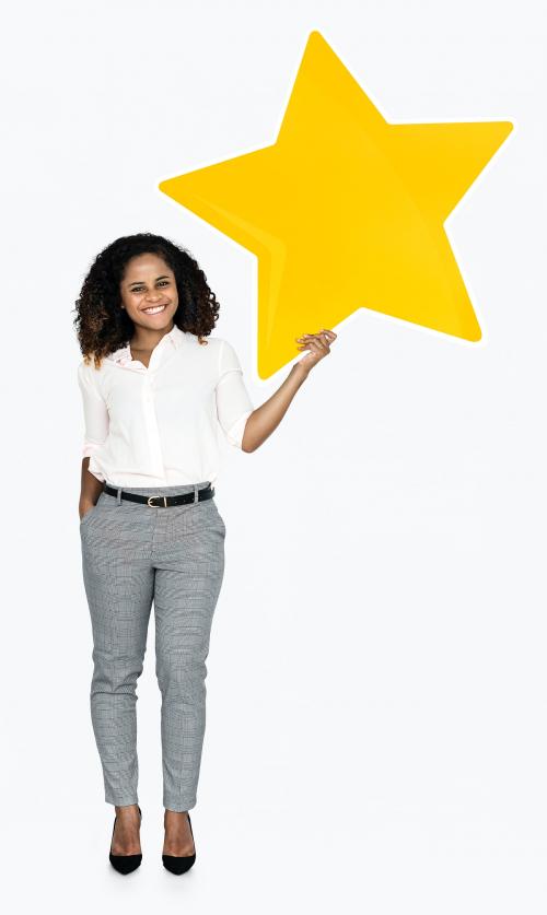 A cheerful woman holding a star - 475139