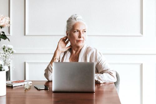 Senior businesswoman using a laptop - 1224213