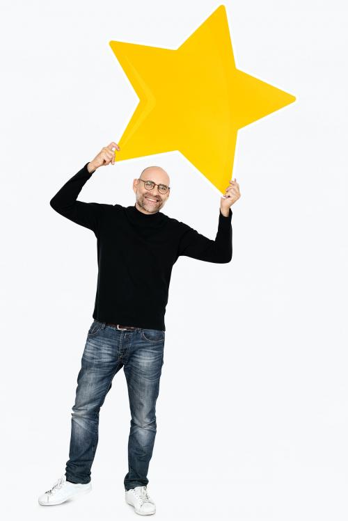 A cheerful man holding a star icon - 475150