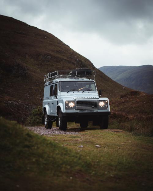 2019, Scotland, Landrover Defender driving in the countryside - 1227074