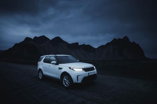2019, Iceland, White Landrover driving in the countryside at night - 1234833