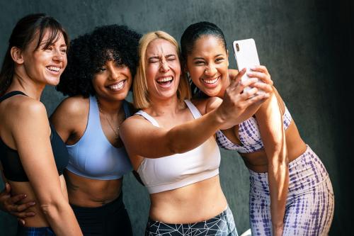 Cheerful sporty women taking a selfie - 1222530