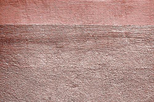 Roughly pink gold painted concrete wall surface background - 596848