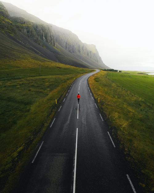Man walking on a road in Iceland - 1227122