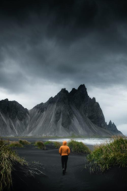 Man walking on a black sand beach, Iceland - 1234758