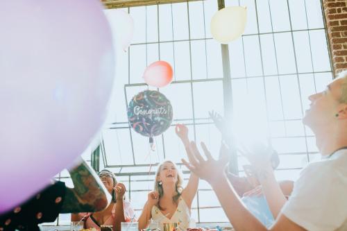 People playing with balloons at a party - 1225178