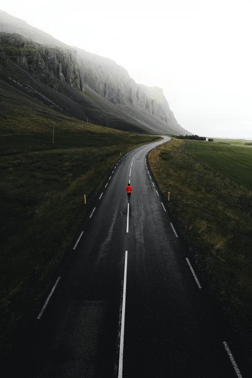 Man walking on a road in Iceland - 1227125