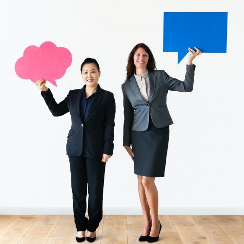 Cheerful people holding speech bubble icon - 414644