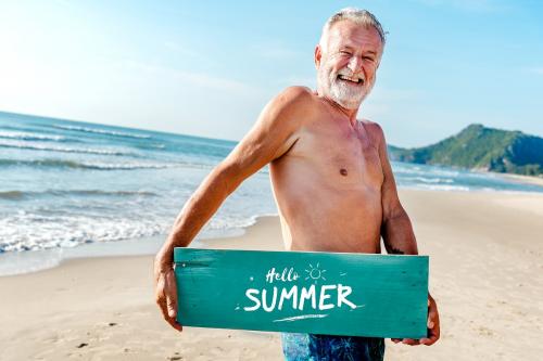 Senior man holding a plank with Hello Summer - 424426