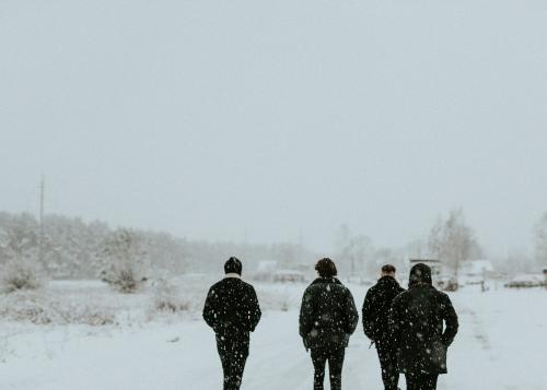Men walking down a snowy road - 598307