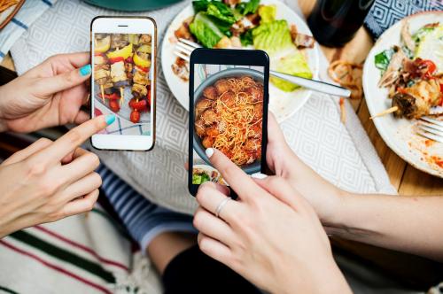 People sharing food photos on mobile phone - 398824