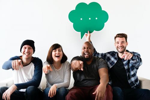 Cheerful people holding speech bubble icon - 414508