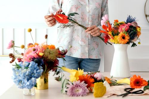 Young florist making a beautiful flower arrangement - 1207341