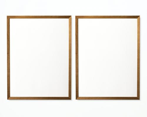 Two photo frames isolated on white wall - 328096