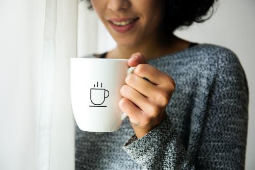 Coffee cup mockup holding by a woman - 296187