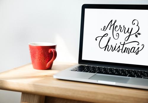 Closeup of computer laptop with Merry Christmas words - 296448