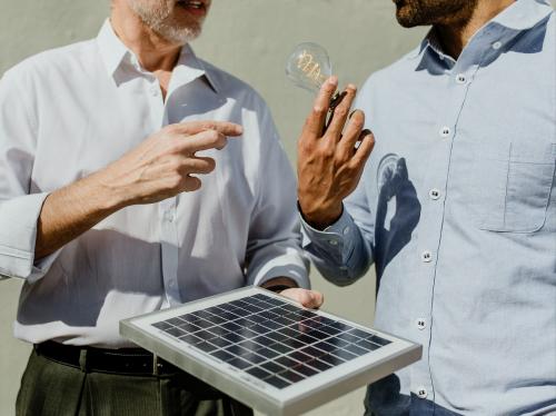 Eco-friendly engineering team with the solar panel - 1213927