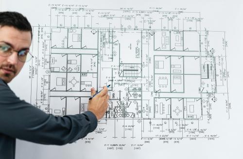 Businessman and blueprint of a building - 259980