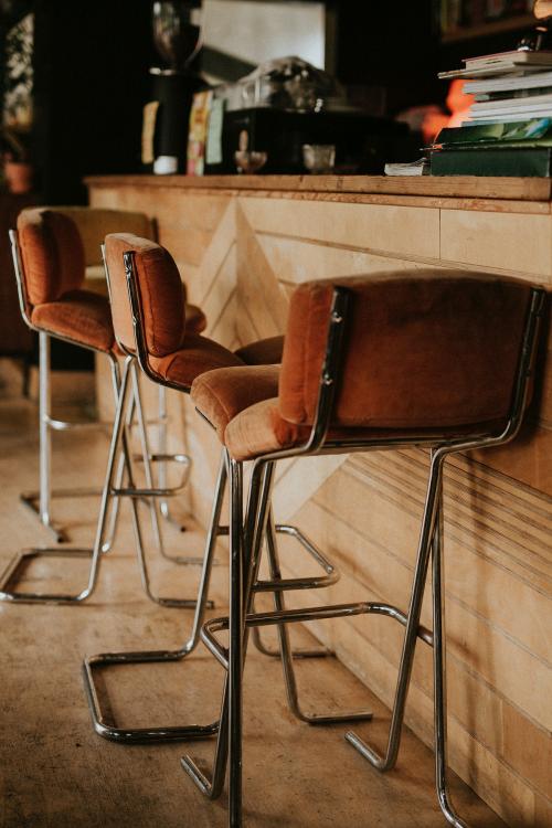 Brown soft stools in a cafe - 1215549