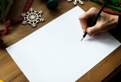 A person preparing to write a Christmas wishlist - 295196