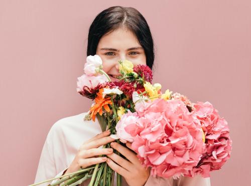 Beautiful young girl with a large pink bouquet - 1207344