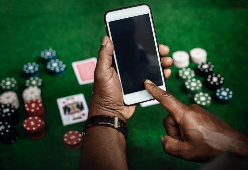 Gambling background and a smartphone with an empty screen - 49954