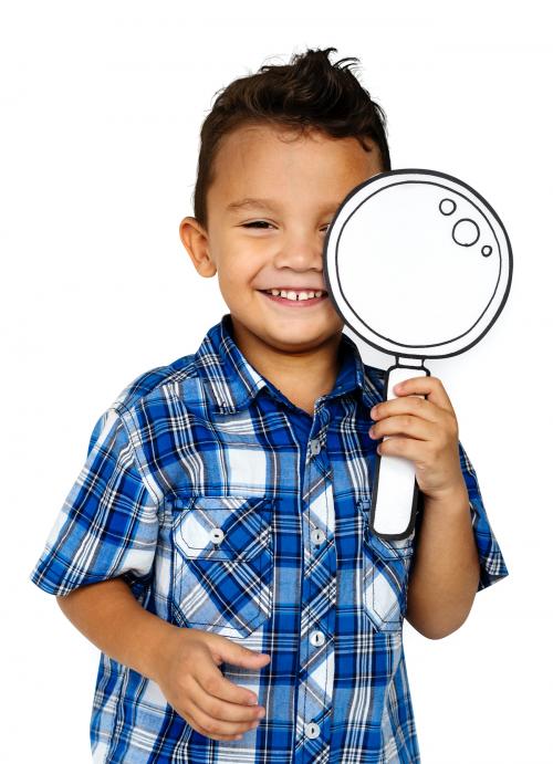 Boy using a paper magnifying glass - 7456