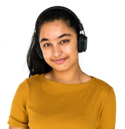 Indian girl smiling and listening music by headphones - 7654
