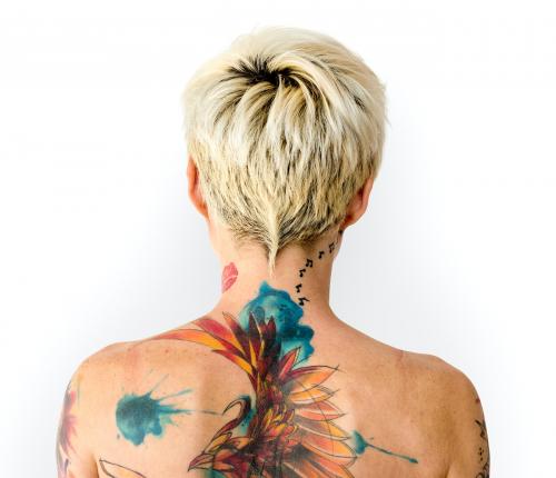 Blonde woman with a colorful back tattoo - 7147