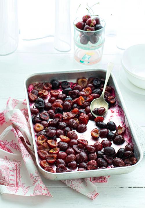 Freshly baked cherries on a baking tray - 1215694