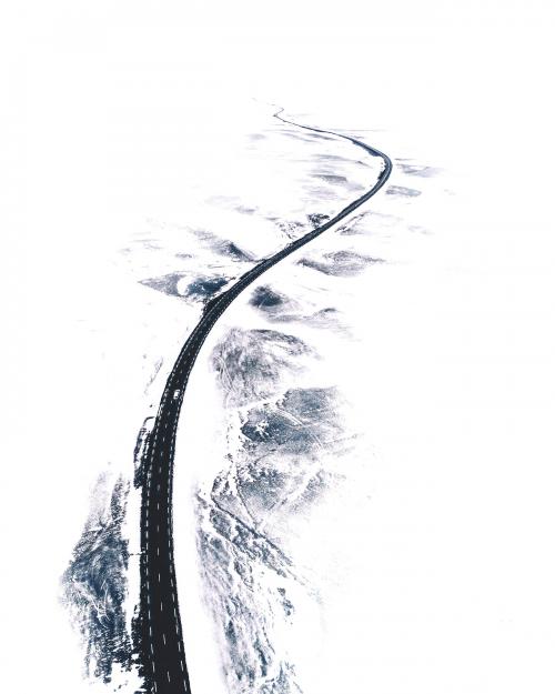Curvy snow covered road in Northern Iceland - 1017130