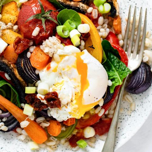 Barley with roasted vegetables and poached egg food photography - 1054334