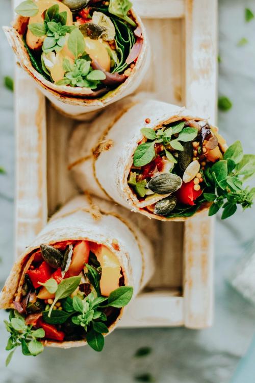 Tortilla wraps with roasted vegetables and mozzarella cheese food photography - 1054384