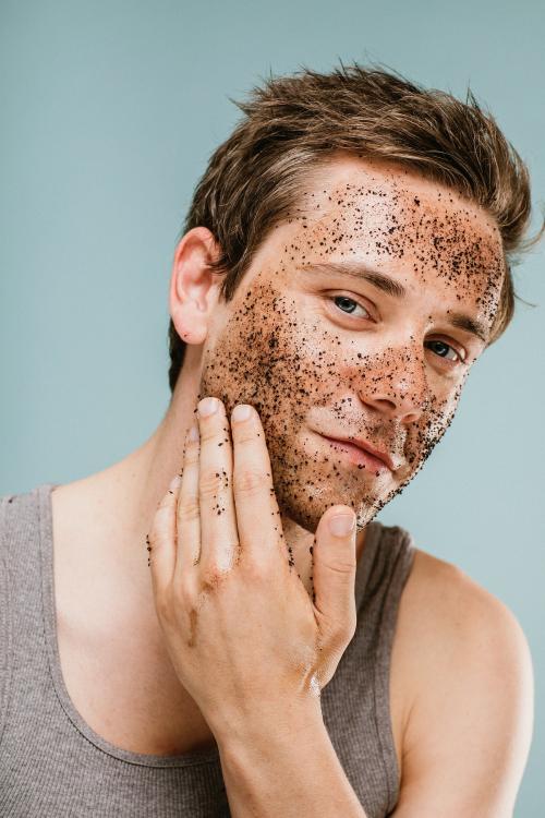 Man doing a face scrub - 1203335